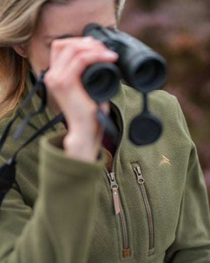 Olive coloured Harehill Womens Varden Fleece Quarter Zip Fleece on a moorland background 