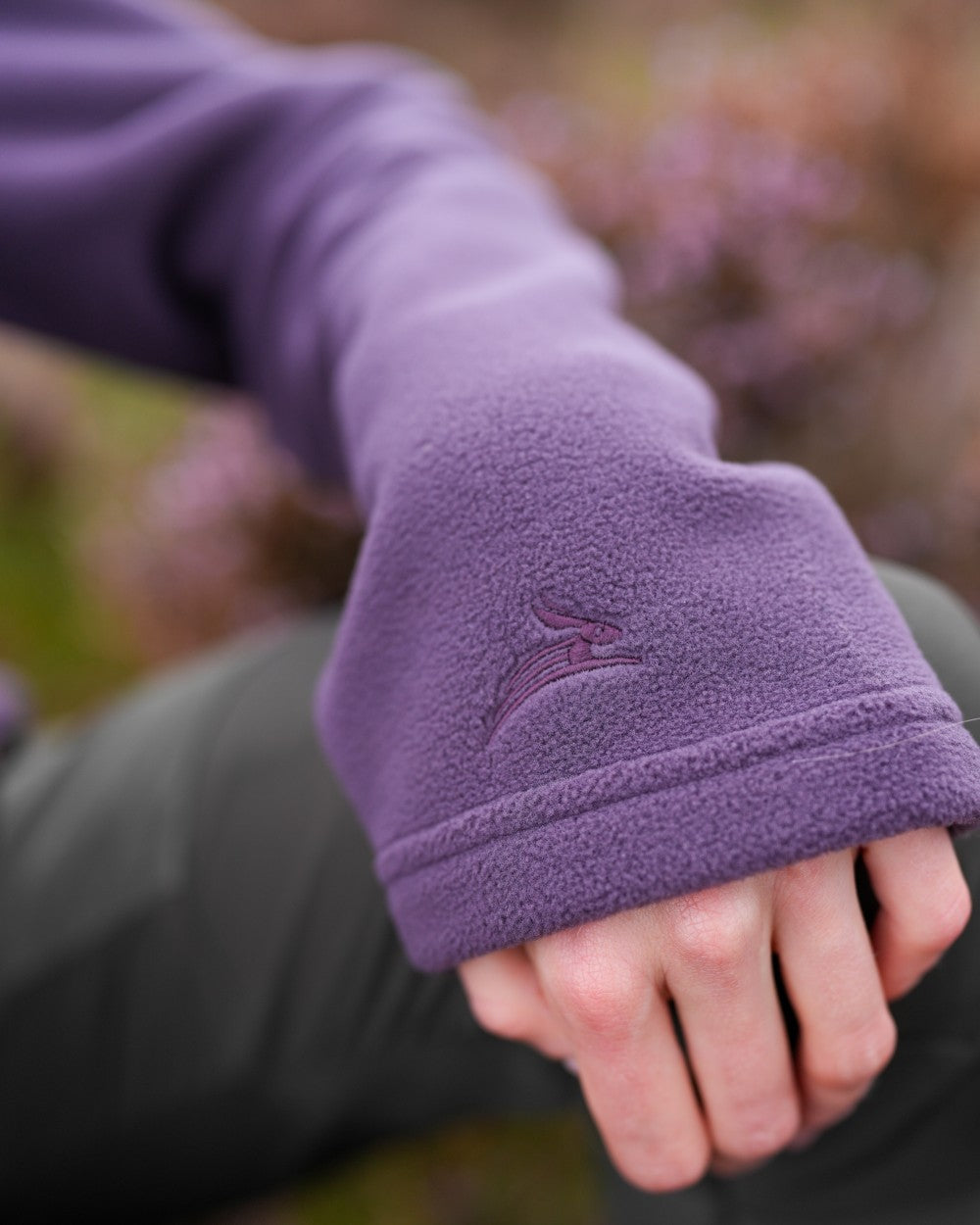 Purple coloured Harehill Womens Varden Fleece Quarter Zip Fleece on a moorland background 