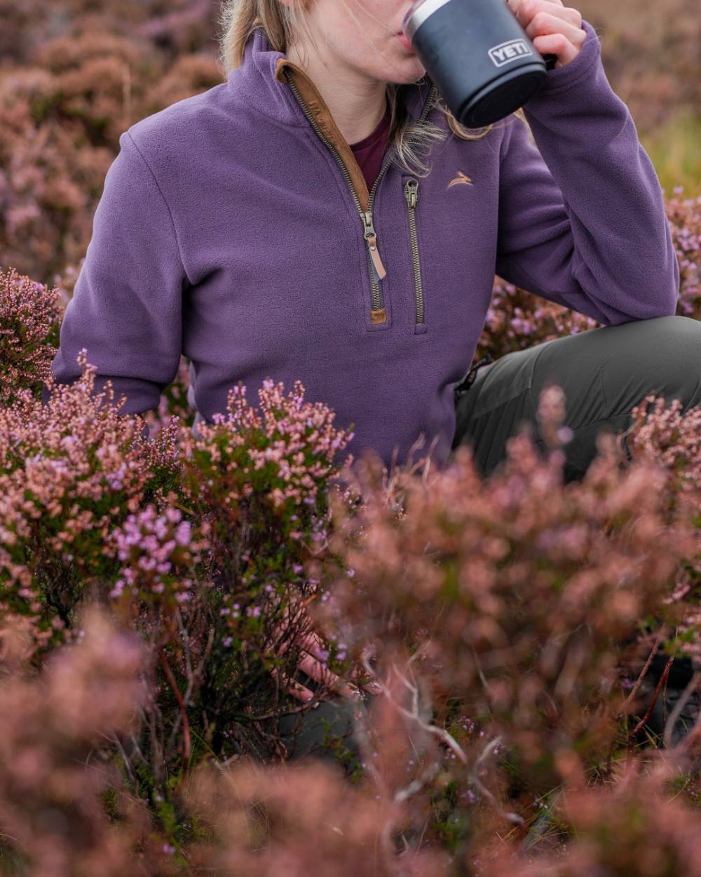 Purple coloured Harehill Womens Varden Fleece Quarter Zip Fleece on a moorland background 