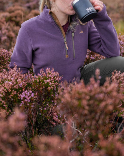 Purple coloured Harehill Womens Varden Fleece Quarter Zip Fleece on a moorland background 