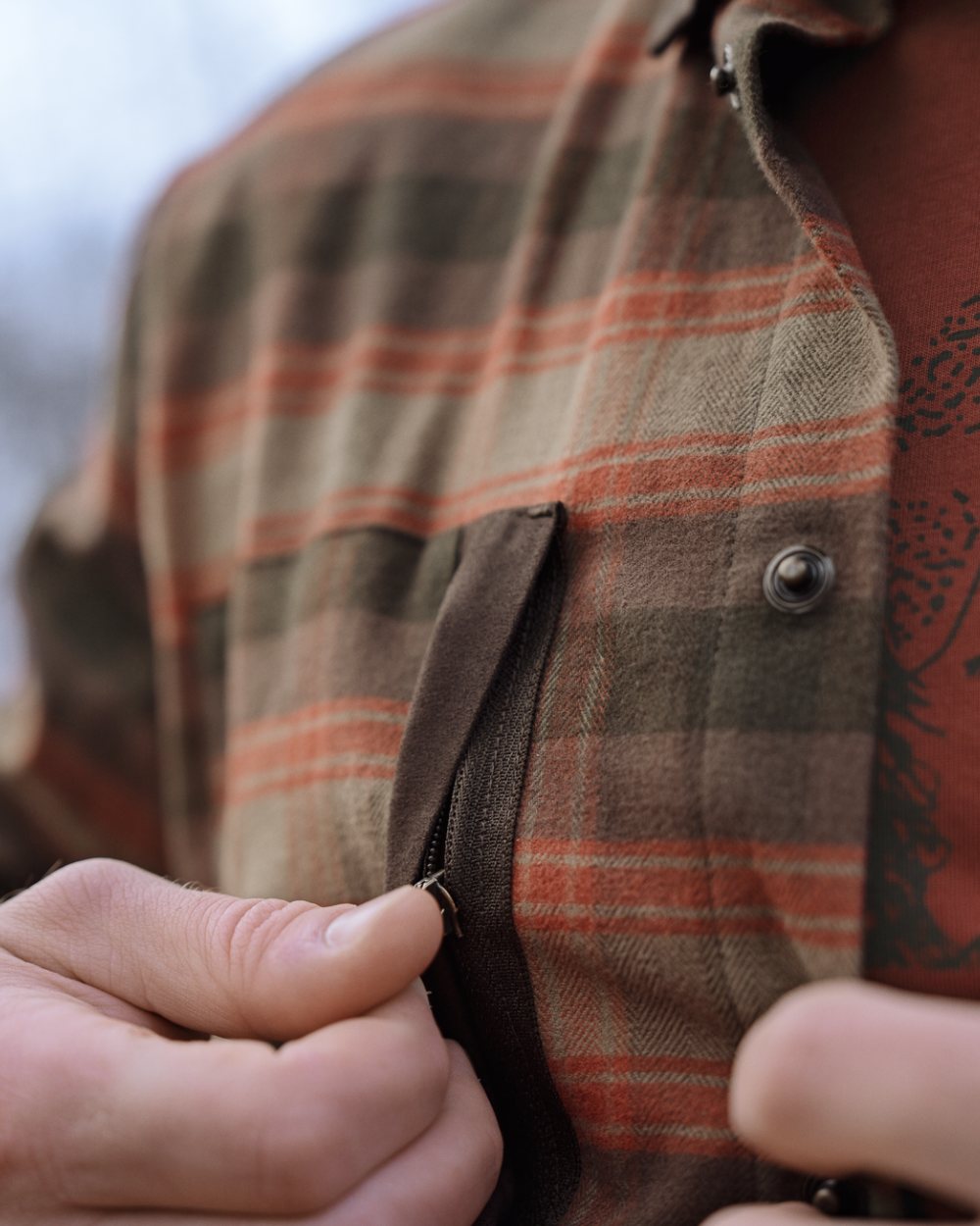 Autumn Orange Check coloured Harkila Aivak Long Sleeved Shirt on forest background 