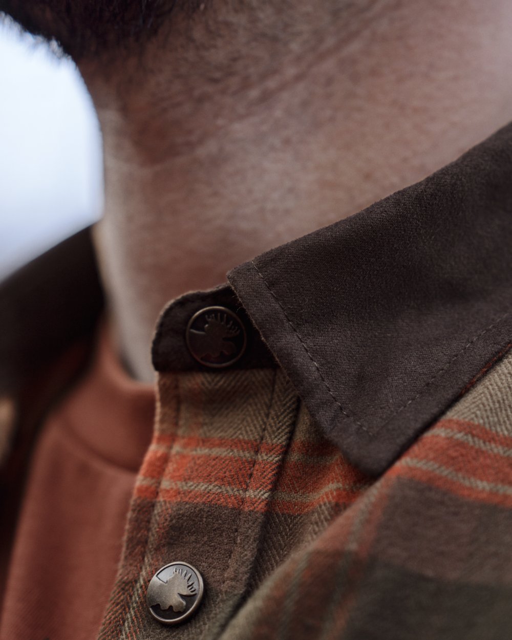 Autumn Orange Check coloured Harkila Aivak Long Sleeved Shirt on forest background 