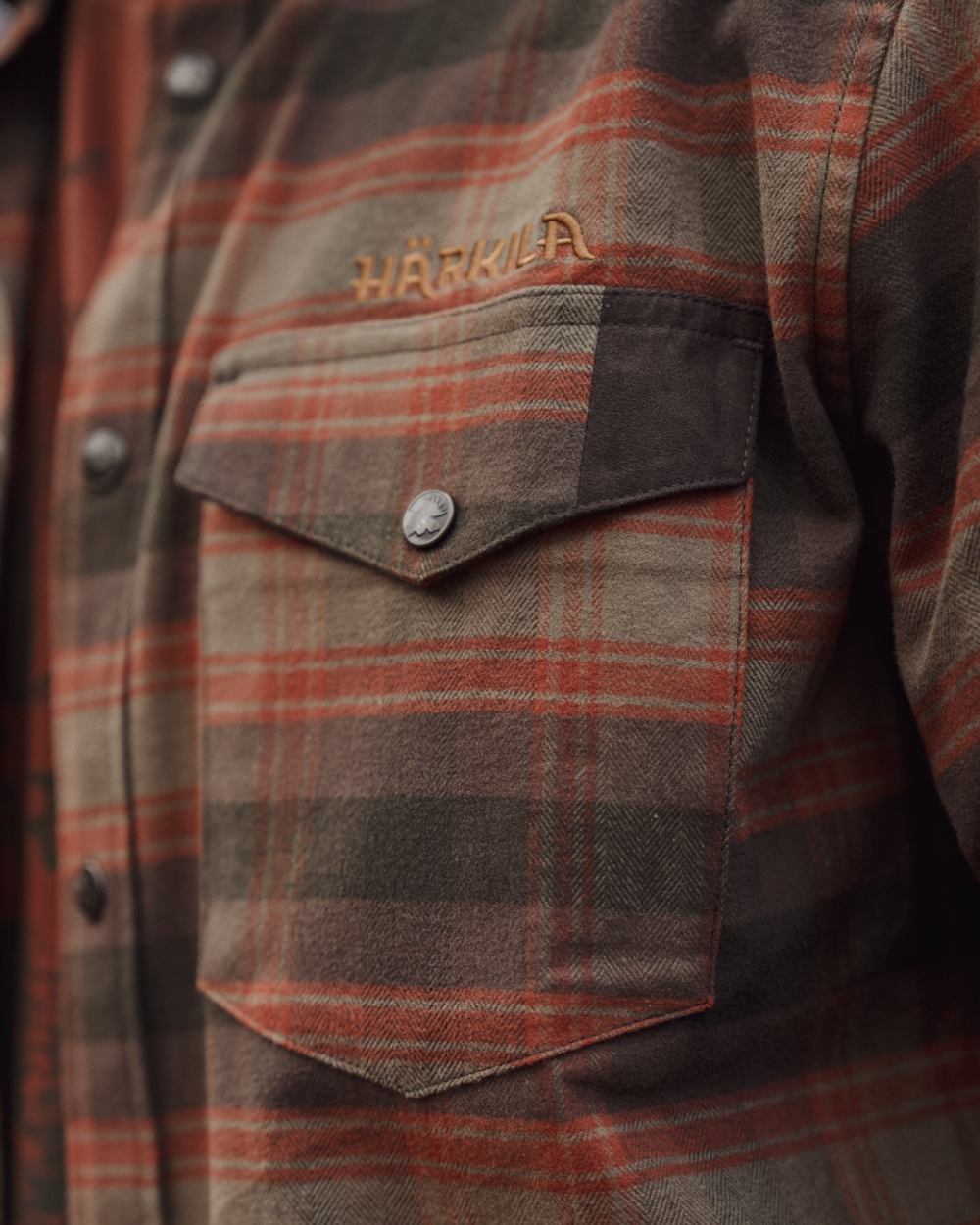 Autumn Orange Check coloured Harkila Aivak Long Sleeved Shirt on forest background 