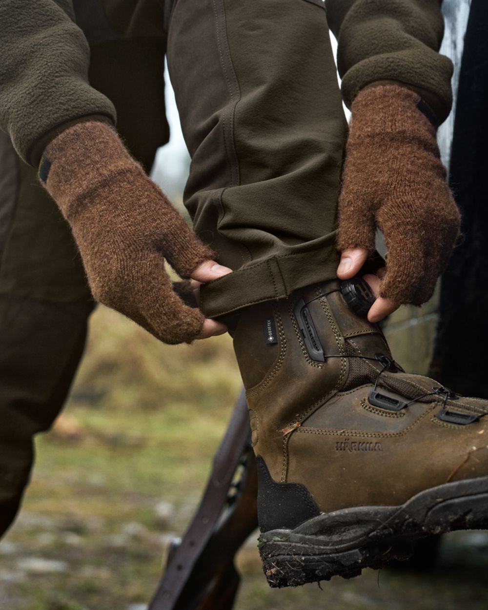 Pinecone Brown Coloured Harkila Alpacka Half Finger Gloves on outdoor background 