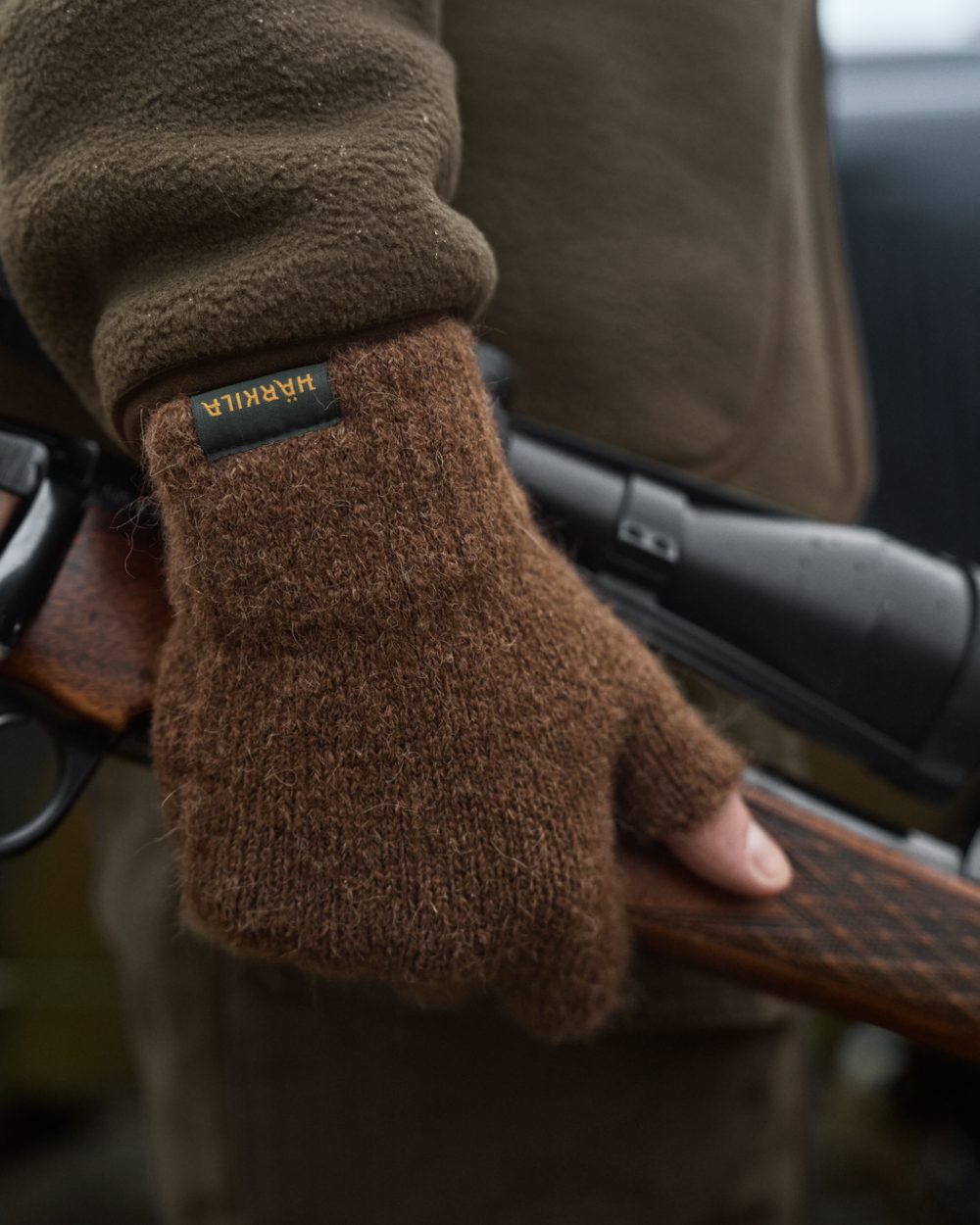 Pinecone Brown Coloured Harkila Alpacka Half Finger Gloves on outdoor background 