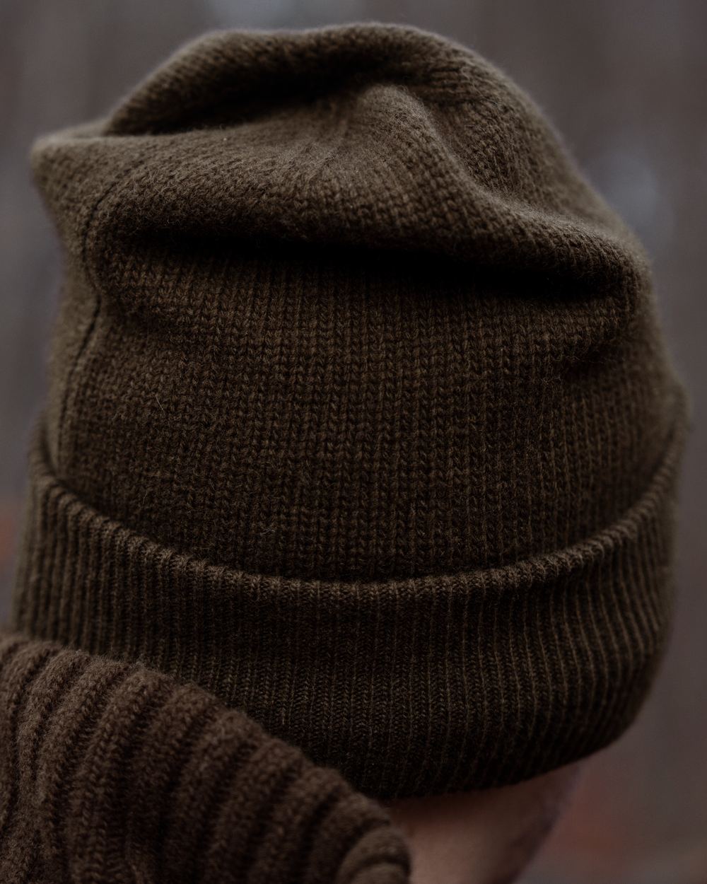 Demitasse brown coloured Harkila Annaboda WSP Knit Beanie on forest background 