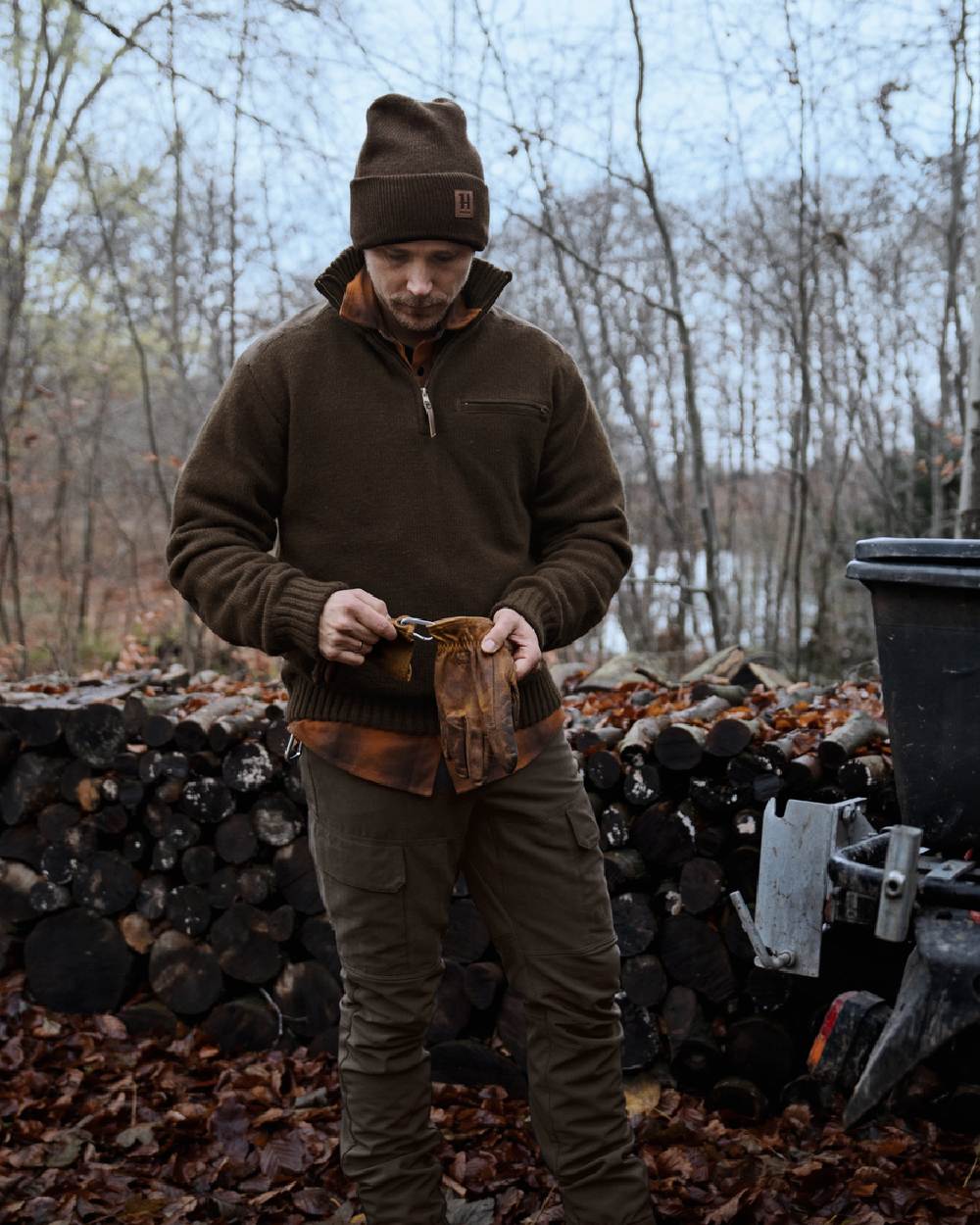 Demitasse Brown coloured Harkila Annaboda WSP Knit Half Zip on forest background 