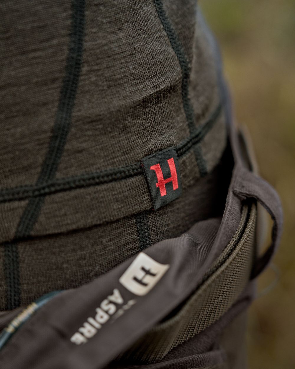 Shadow Brown Coloured Harkila Aspire Base Layer Set on outdoor background 