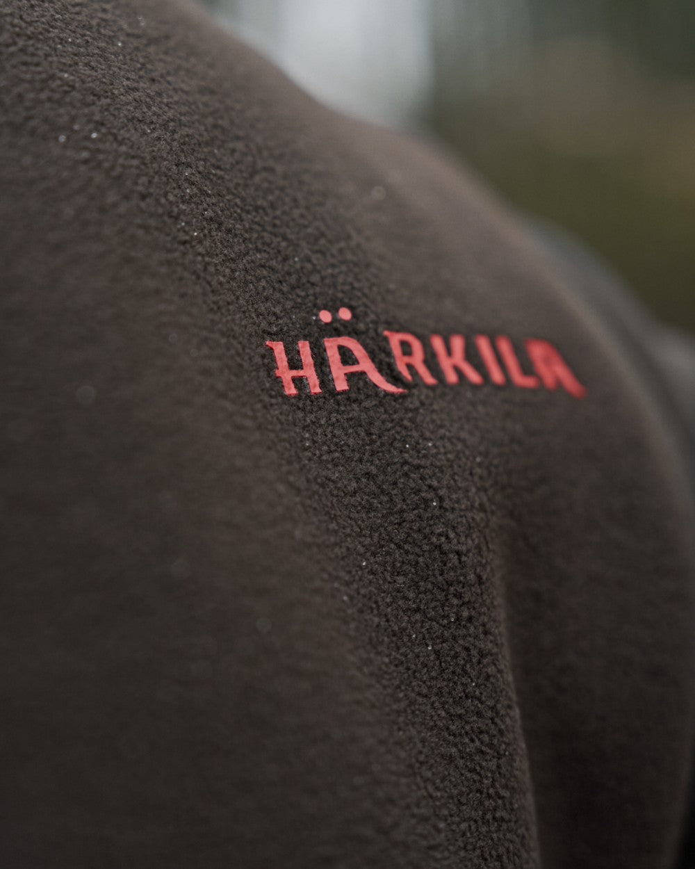 Shadow Brown Coloured Harkila Aspire Fleece Waistcoat on outdoor background 