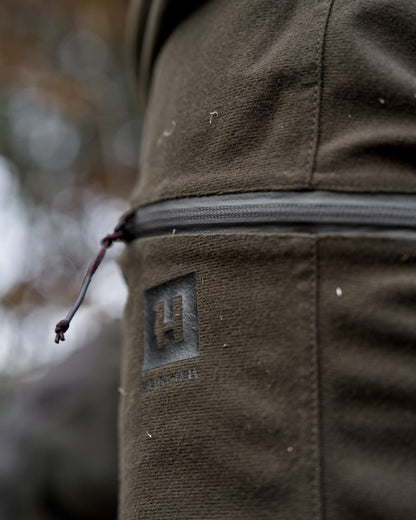 Hunting Green Shadow Brown Coloured Harkila Aspire HWS Trousers on forest background 