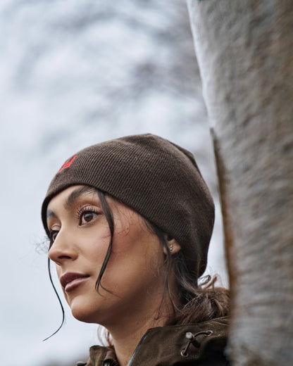 Shadow Brown Red Coloured Harkila Aspire Reversible Beanie on outdoor background 