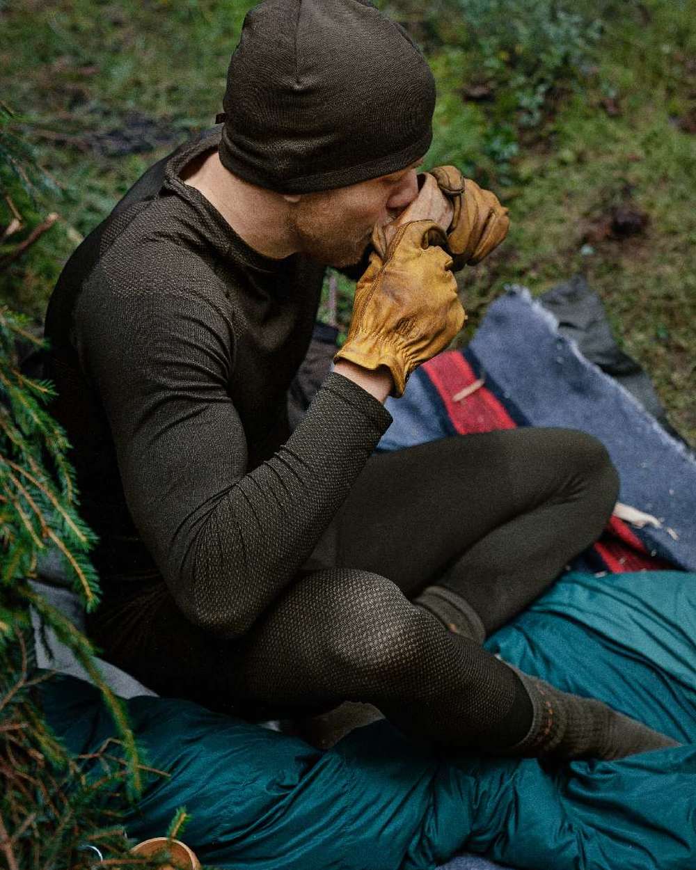 Dark Willow Green Coloured Harkila Base Active Long Sleeve O-Neck on forest background 