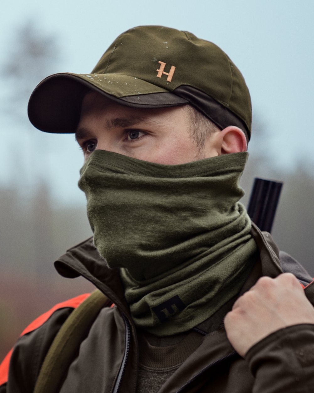 Dark Olive Coloured Harkila Base All Season Tubular Limited Edition on outdoor background 