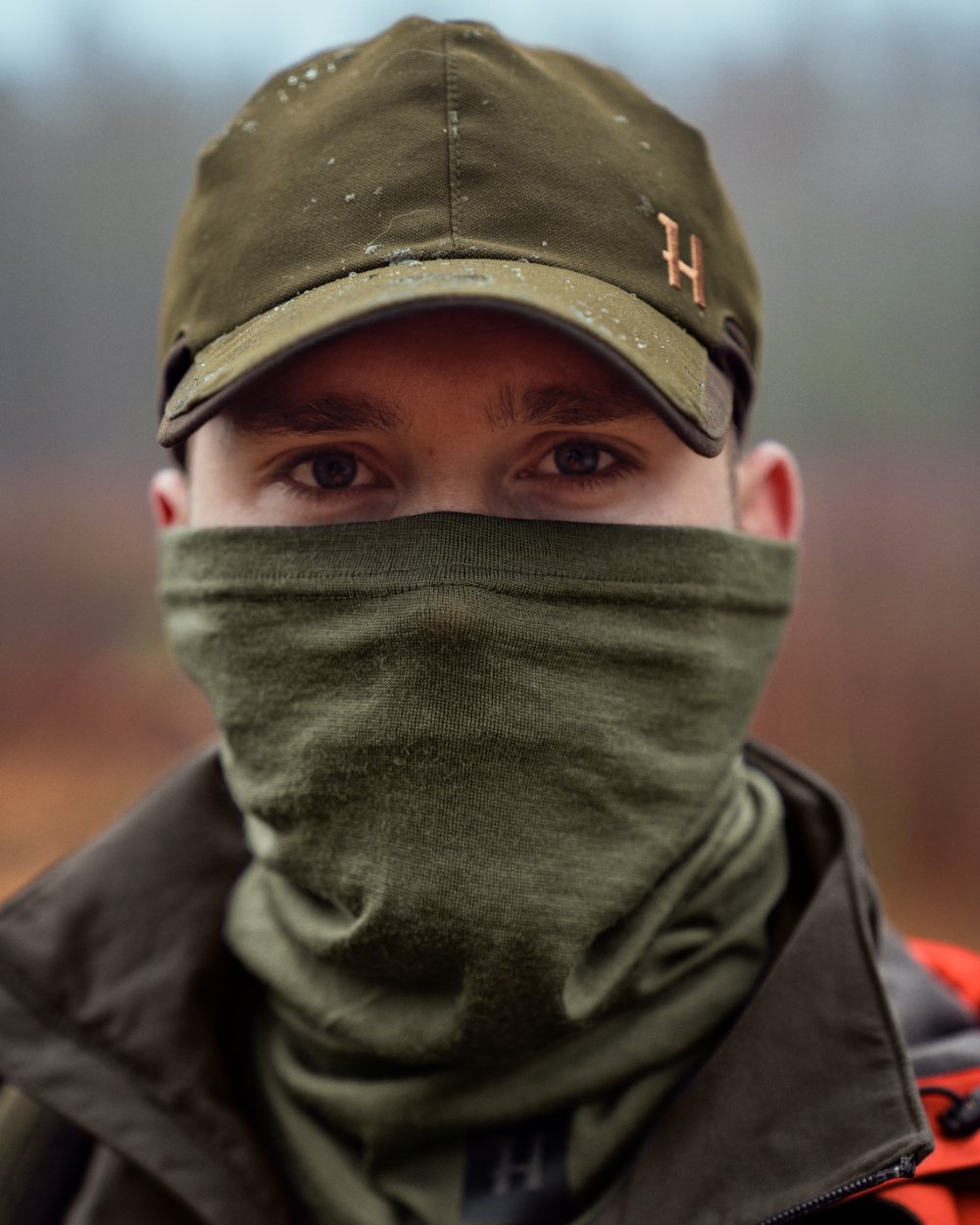 Dark Olive Coloured Harkila Base All Season Tubular Limited Edition on outdoor background 