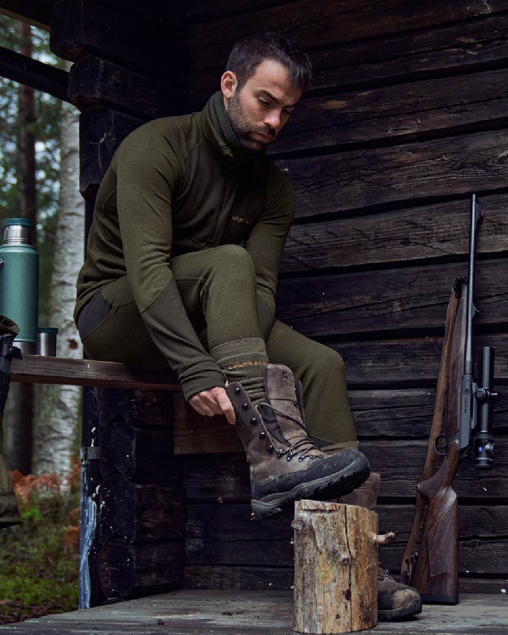Willow Green Shadow Brown Coloured Harkila Base Warm Zip Neck on countryside background 