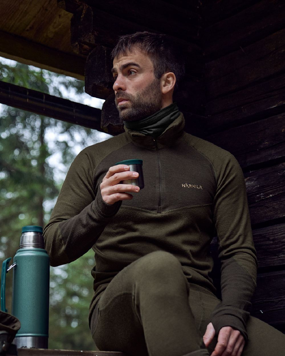 Willow Green Shadow Brown Coloured Harkila Base Warm Zip Neck on countryside background 