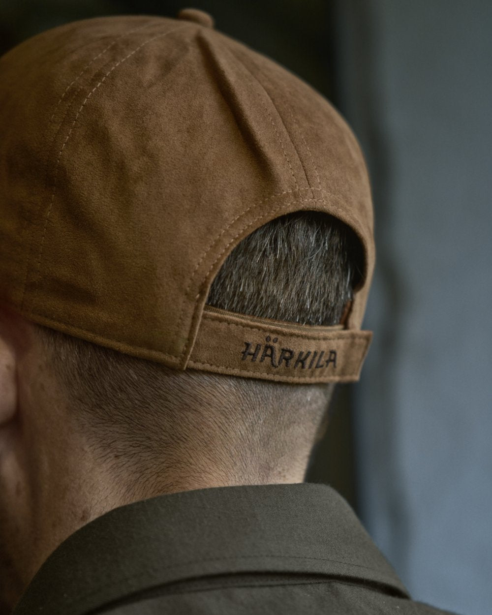 Antique Bronze Coloured Harkila Berkshire Cap on outdoor background 