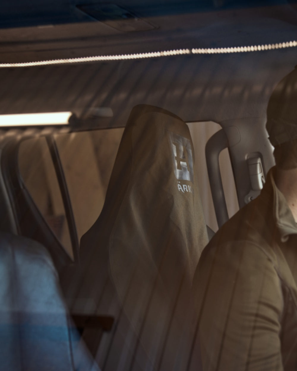 Hunting Green Coloured Harkila Car Seat Cover on Car background 