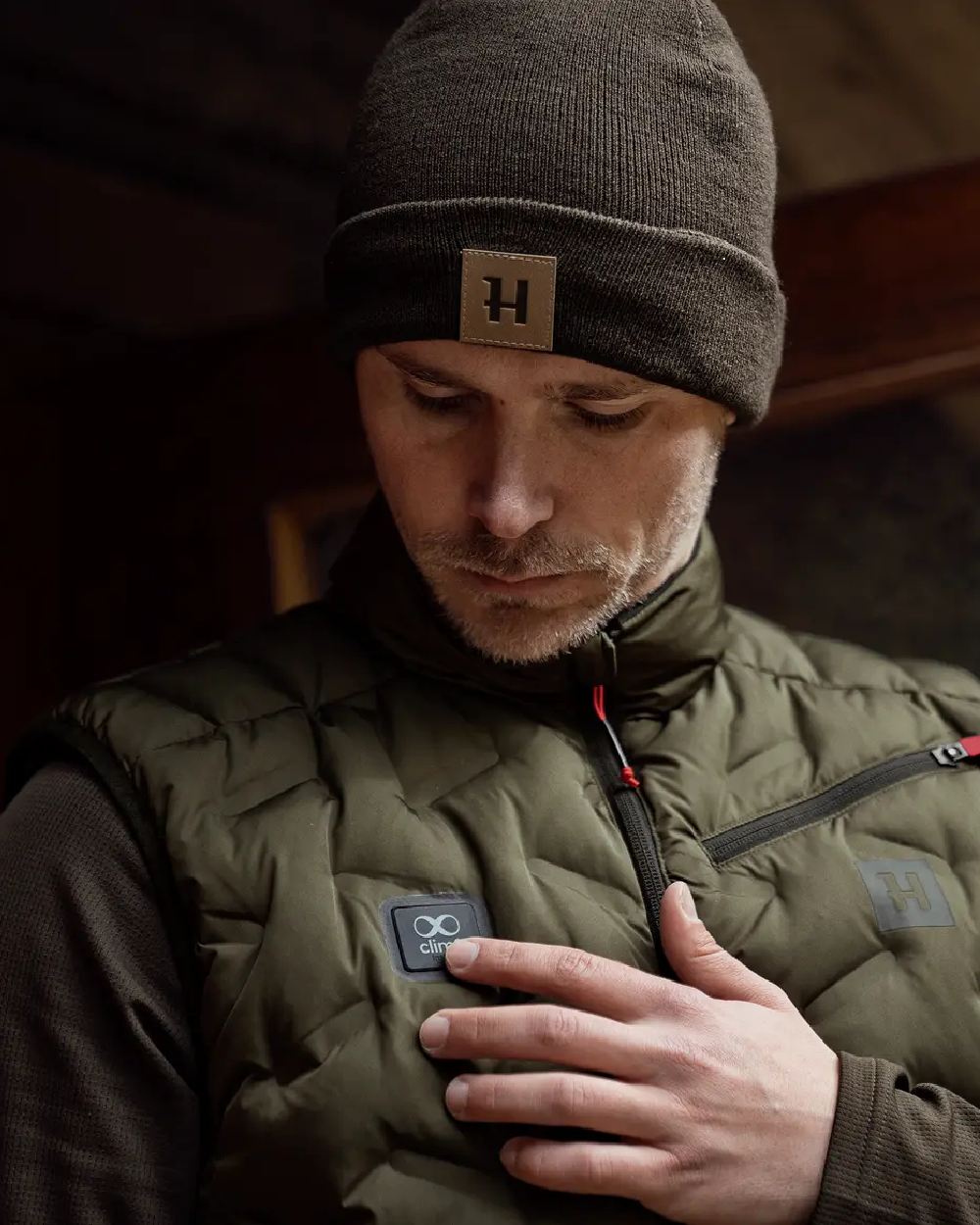 Willow Green Coloured Harkila Clim8 Insulated Waistcoat on outdoor background 