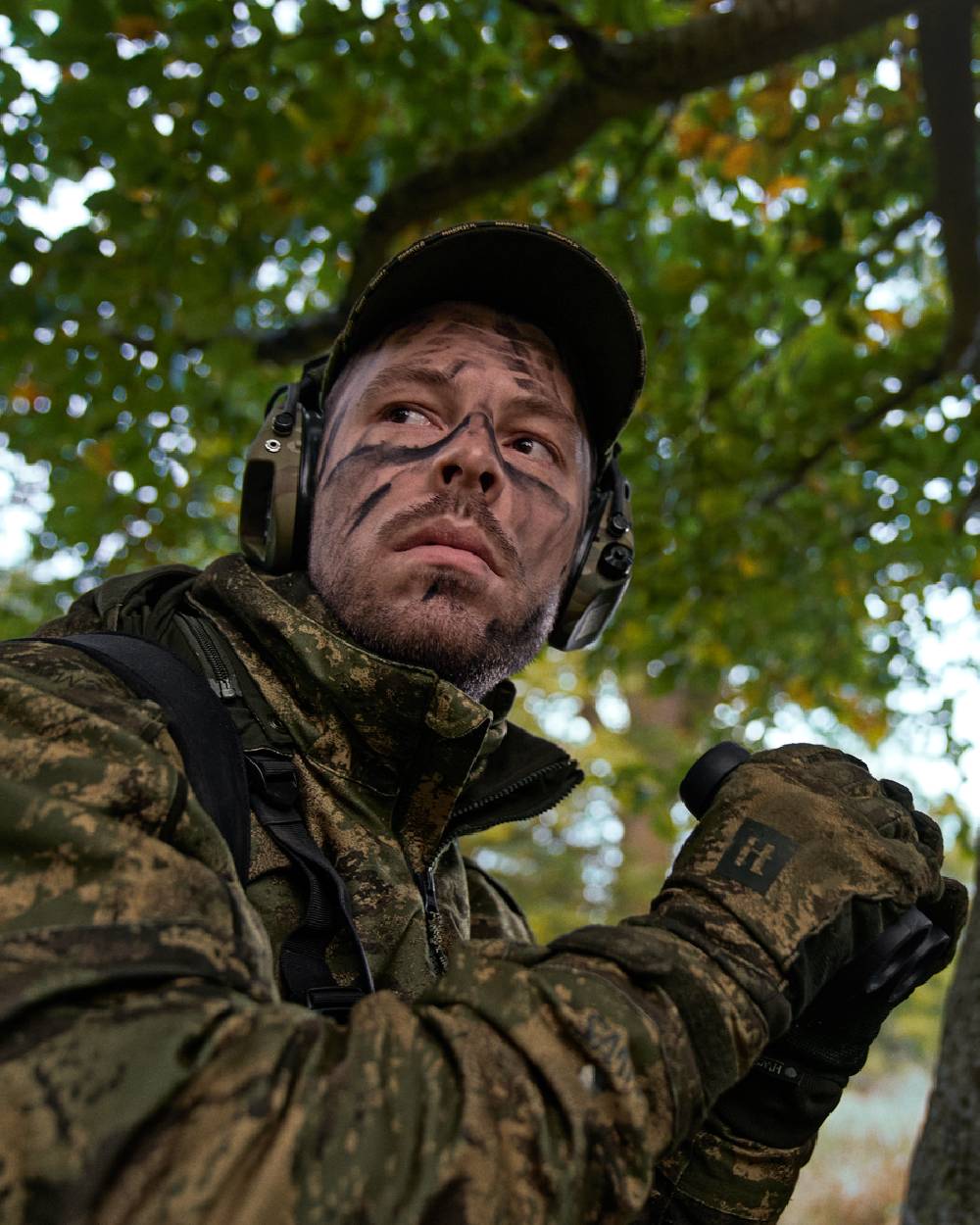 AXIS Forest Coloured Harkila Deer Stalker Camo HWS Jacket on forest background 