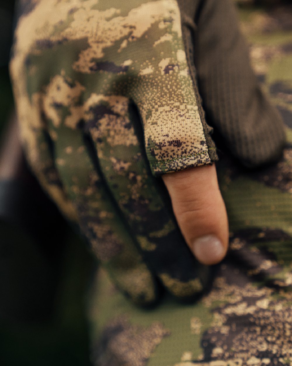 AXIS Forest coloured Harkila Deer Stalker Camo Mesh Gloves on blurry background 