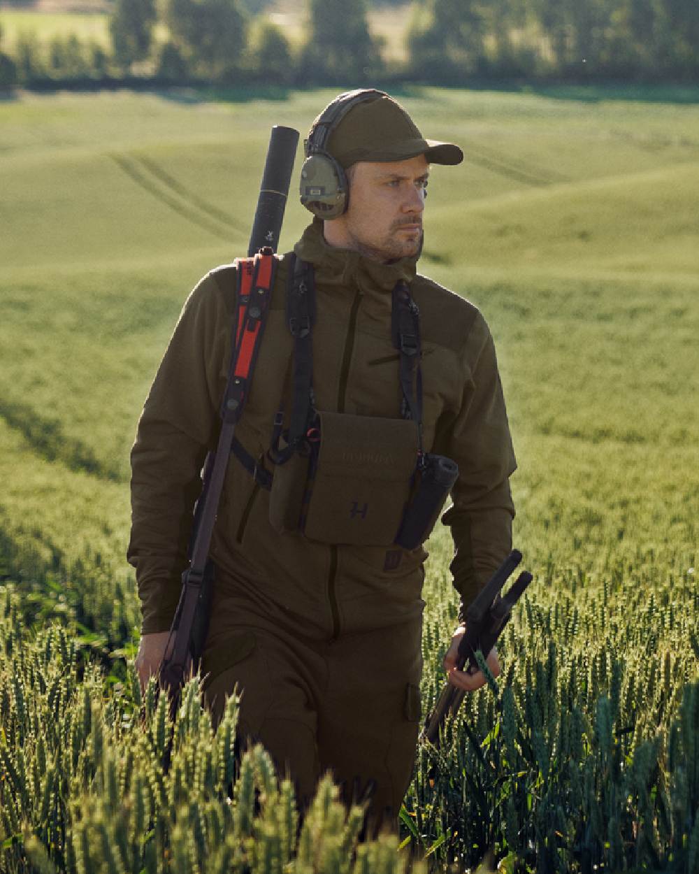 Willow Green Shadow Brown Coloured Harkila Deer Stalker Fleece Hoodie on outdoor background 