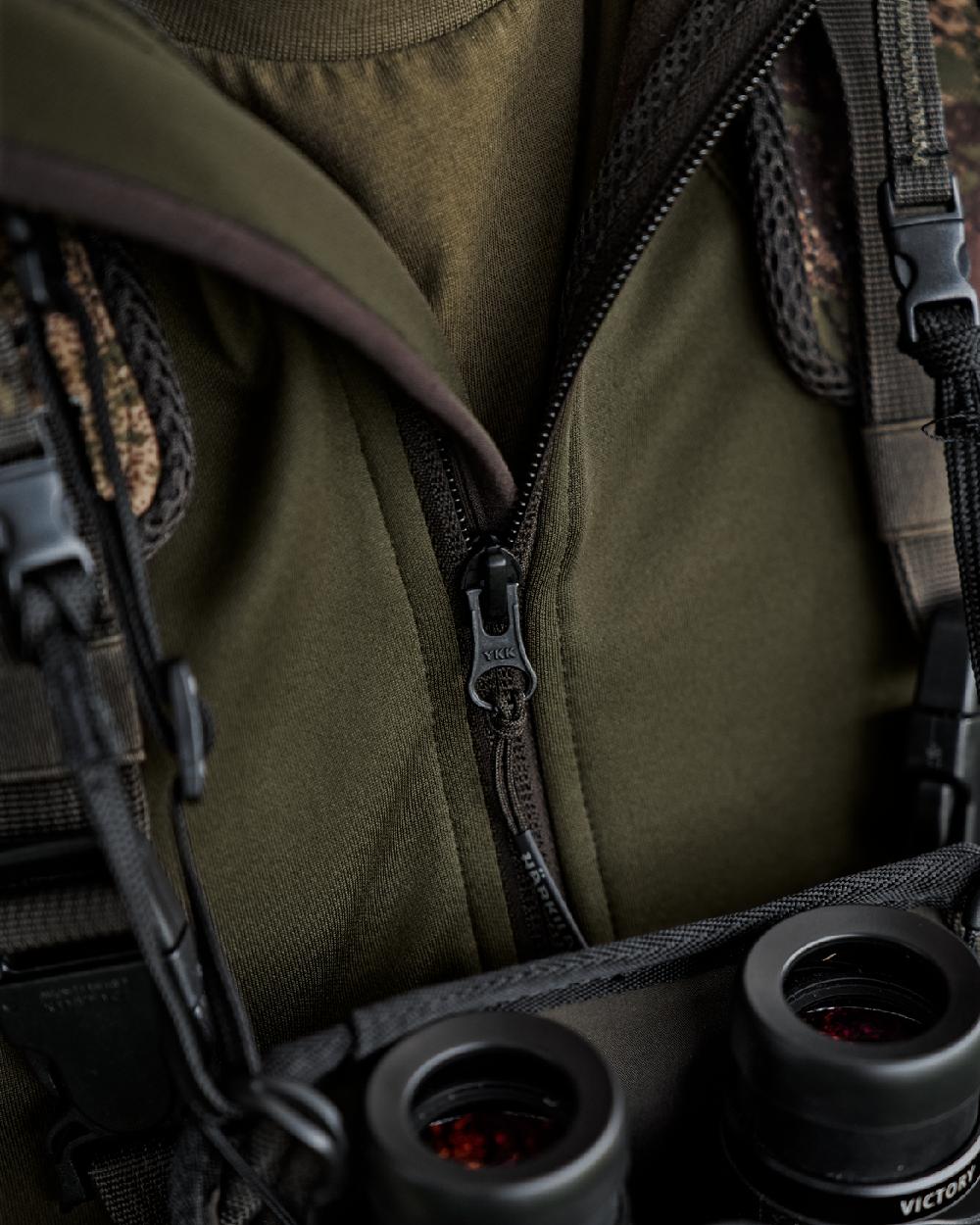 Willow Green Coloured Harkila Deer Stalker Full Zip Fleece Hoodie on blurry background 