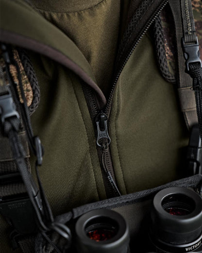 Willow Green Coloured Harkila Deer Stalker Full Zip Fleece Hoodie on blurry background 