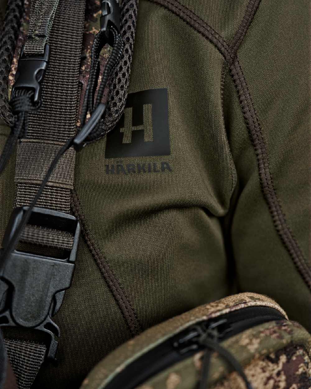 Willow Green Coloured Harkila Deer Stalker Full Zip Fleece Hoodie on blurry background 