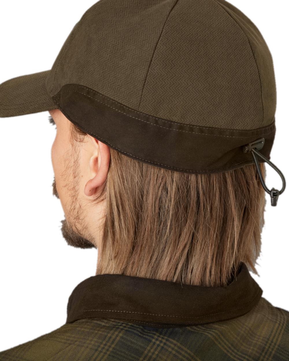 Willow Green Coloured Harkila Driven Hunt HSP Insulated Cap on white background 