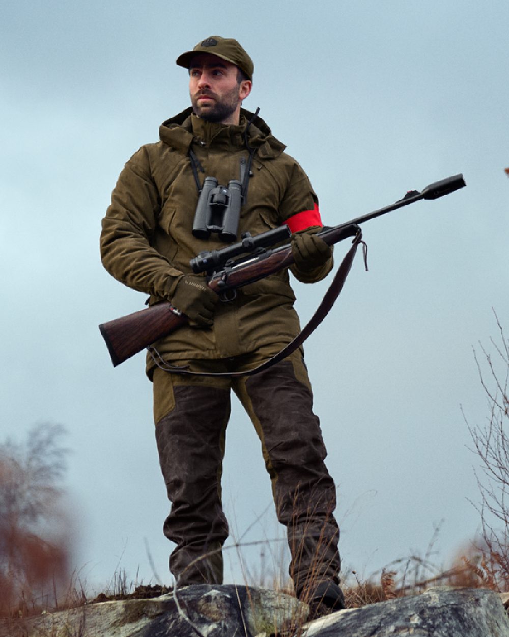Willow Green Shadow Brown Coloured Harkila Driven Hunt HWS Leather Trousers on forest background 
