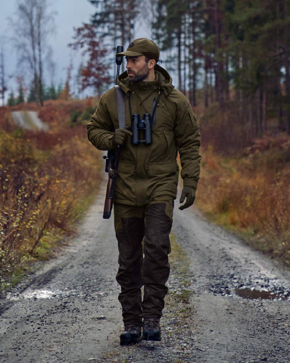 Willow Green Shadow Brown Coloured Harkila Driven Hunt HWS Leather Trousers on forest background 
