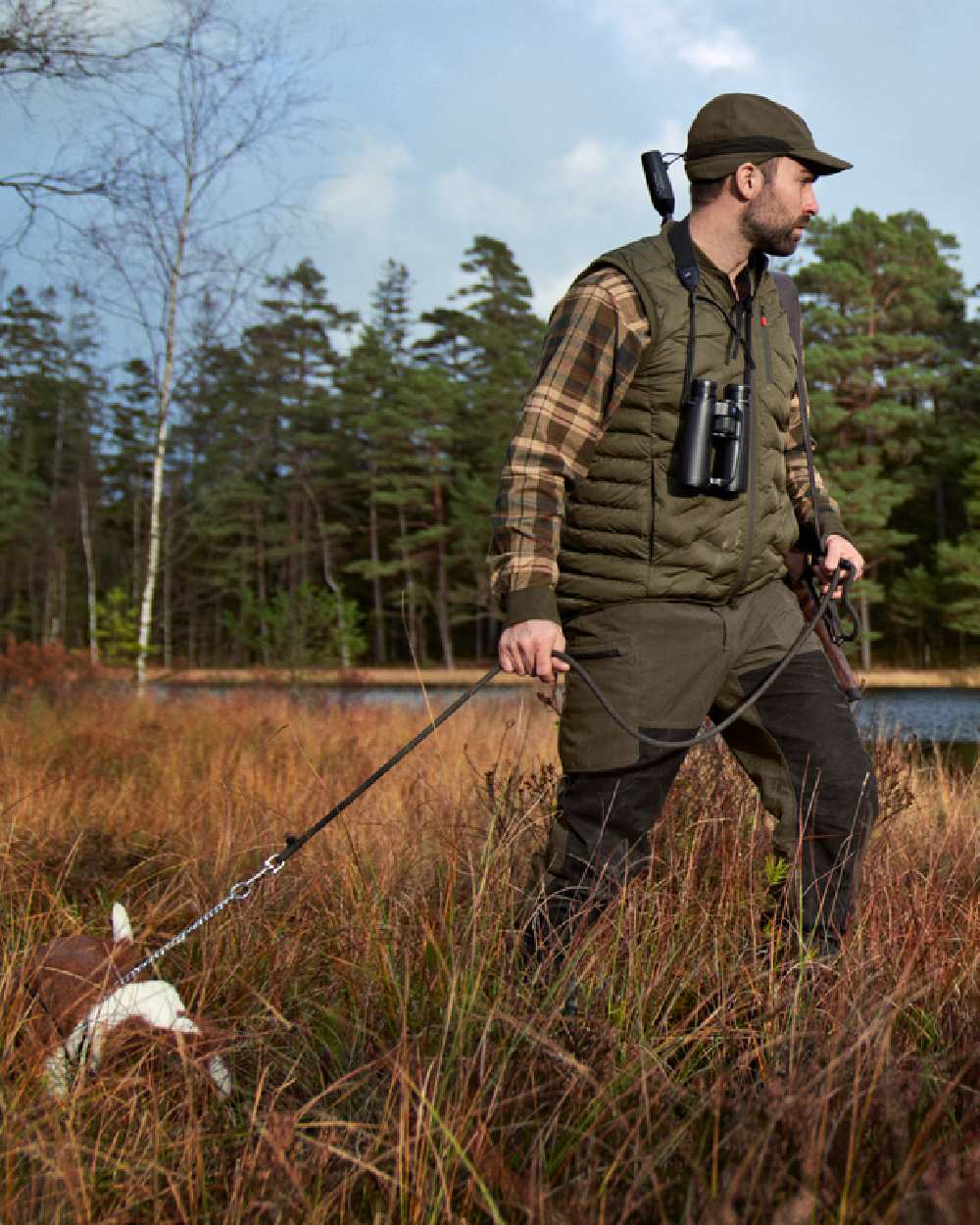 Willow Green Shadow Brown Coloured Harkila Driven Hunt HWS Leather Trousers on forest background 