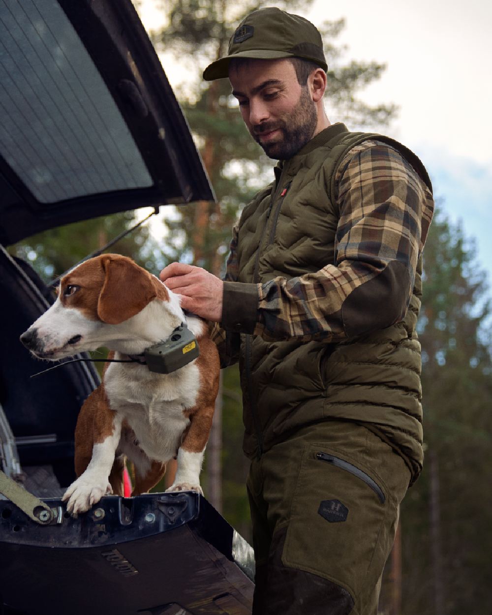 Willow Green Coloured Harkila Driven Hunt Insulated Waistcoat on outdoor background 