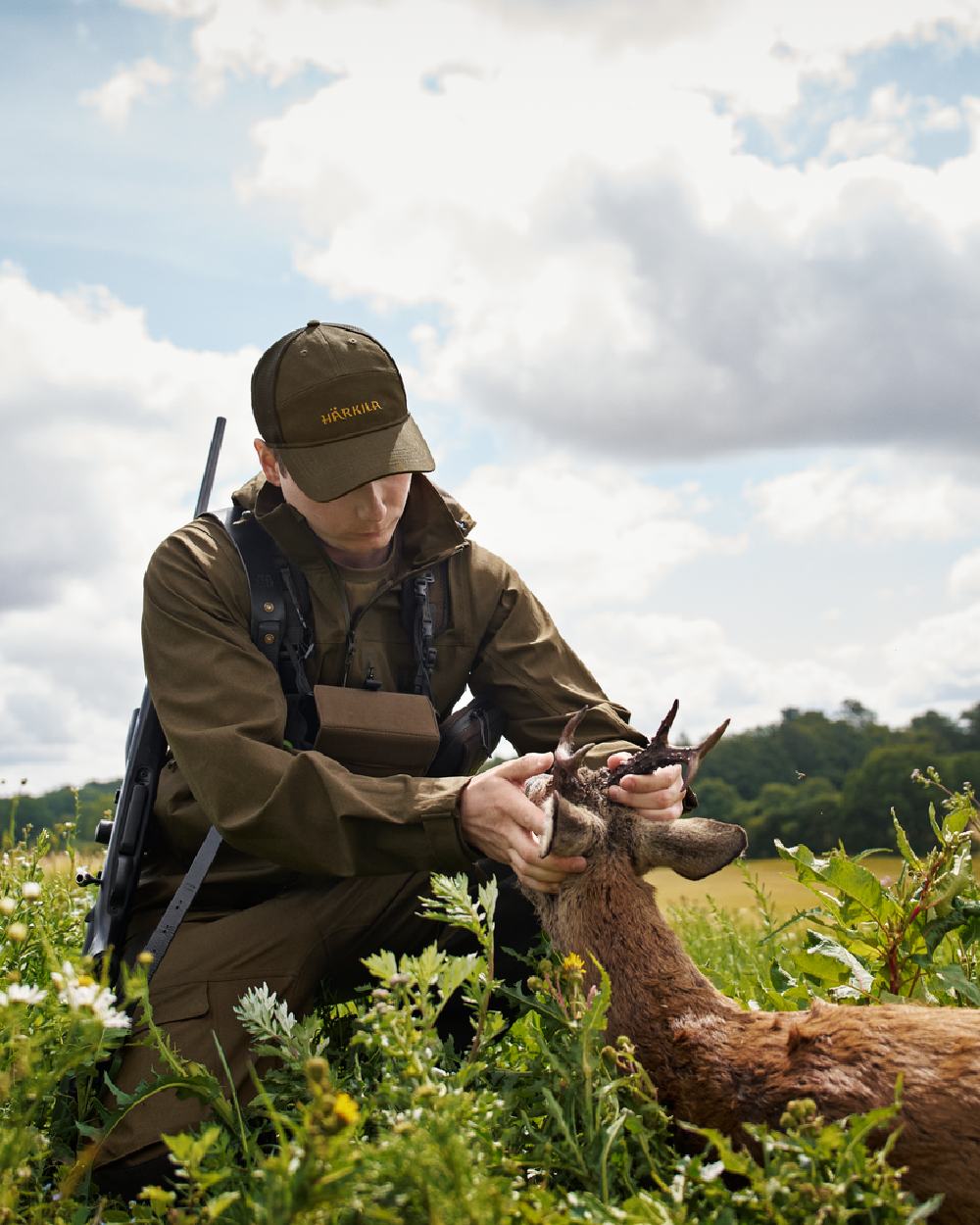 Hunting Green Coloured Harkila Finnmark HWS Jacket on forest background 