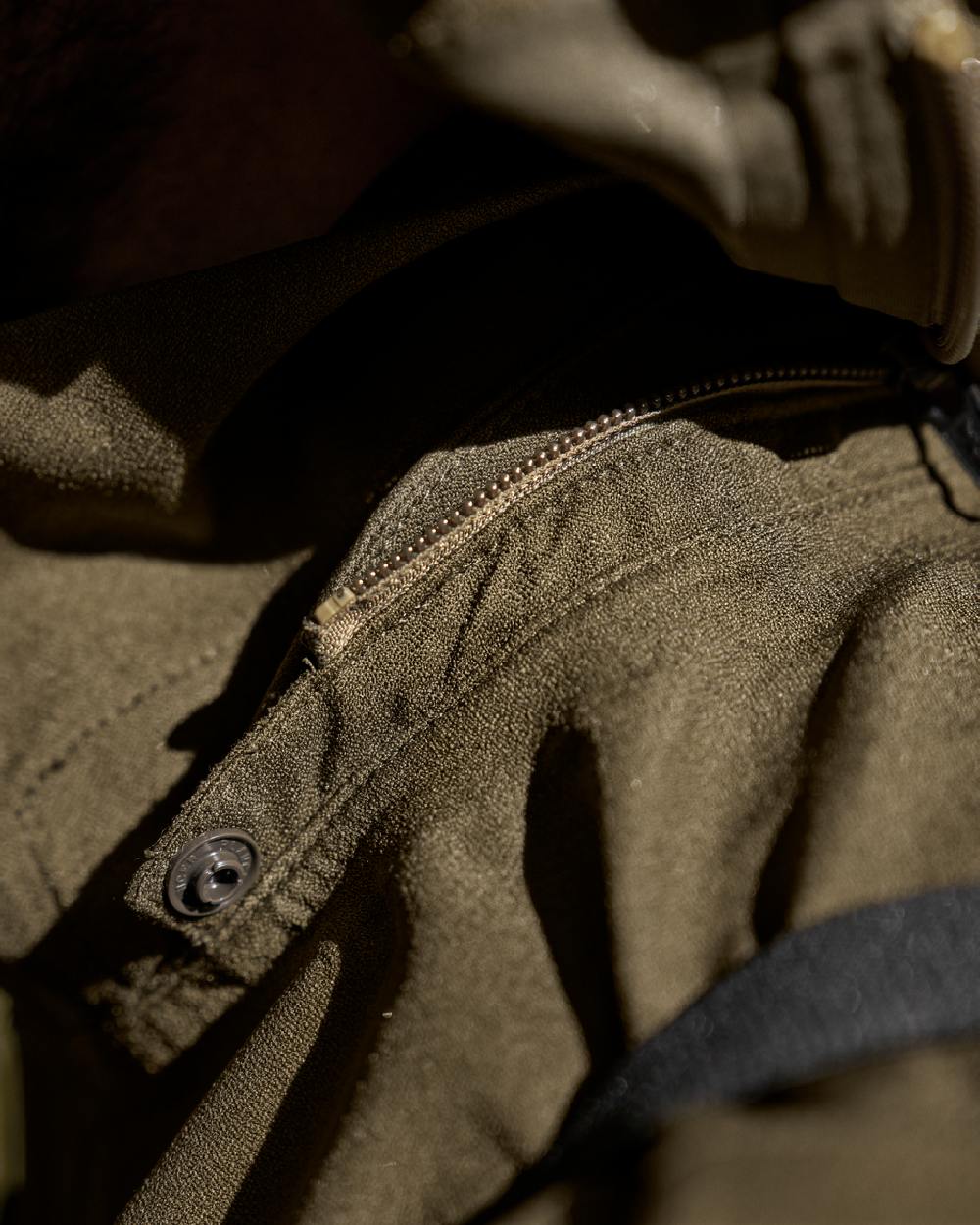 Hunting Green Coloured Harkila Finnmark HWS Jacket on blurry background 