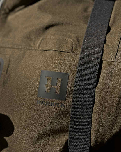 Hunting Green Coloured Harkila Finnmark HWS Jacket on blurry background 