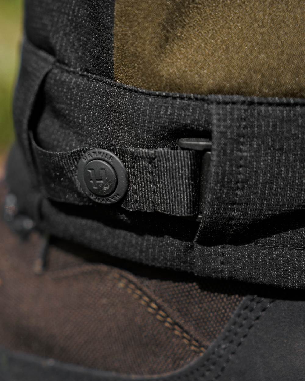 Hunting Green Coloured Harkila Finnmark HWS Trousers on blurry background 