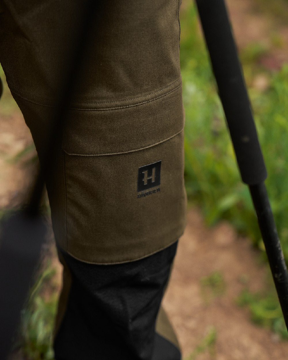 Hunting Green Coloured Harkila Finnmark HWS Trousers on blurry background 
