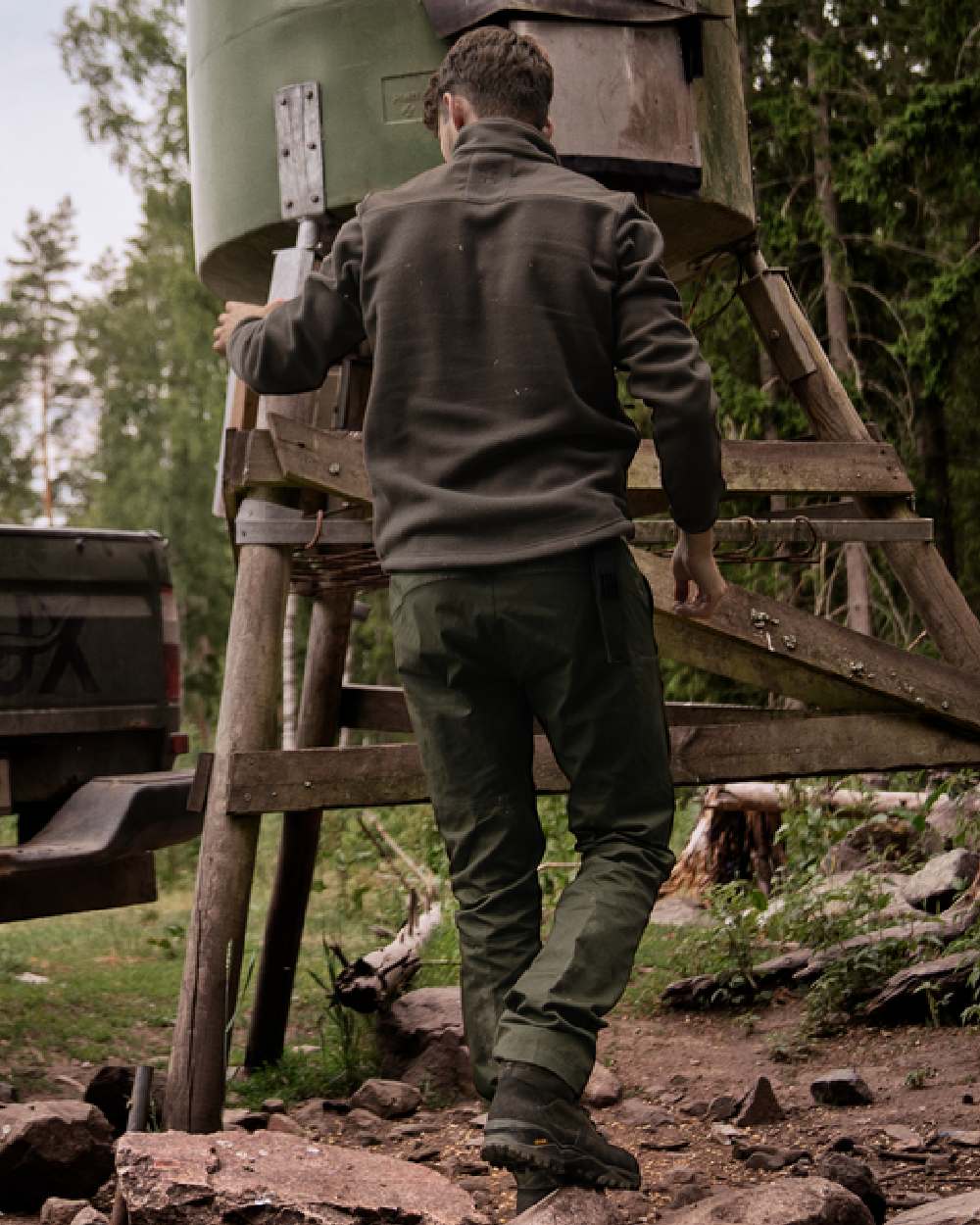 Shadow Brown Coloured Harkila Fjell Fleece Jacket on forest background 