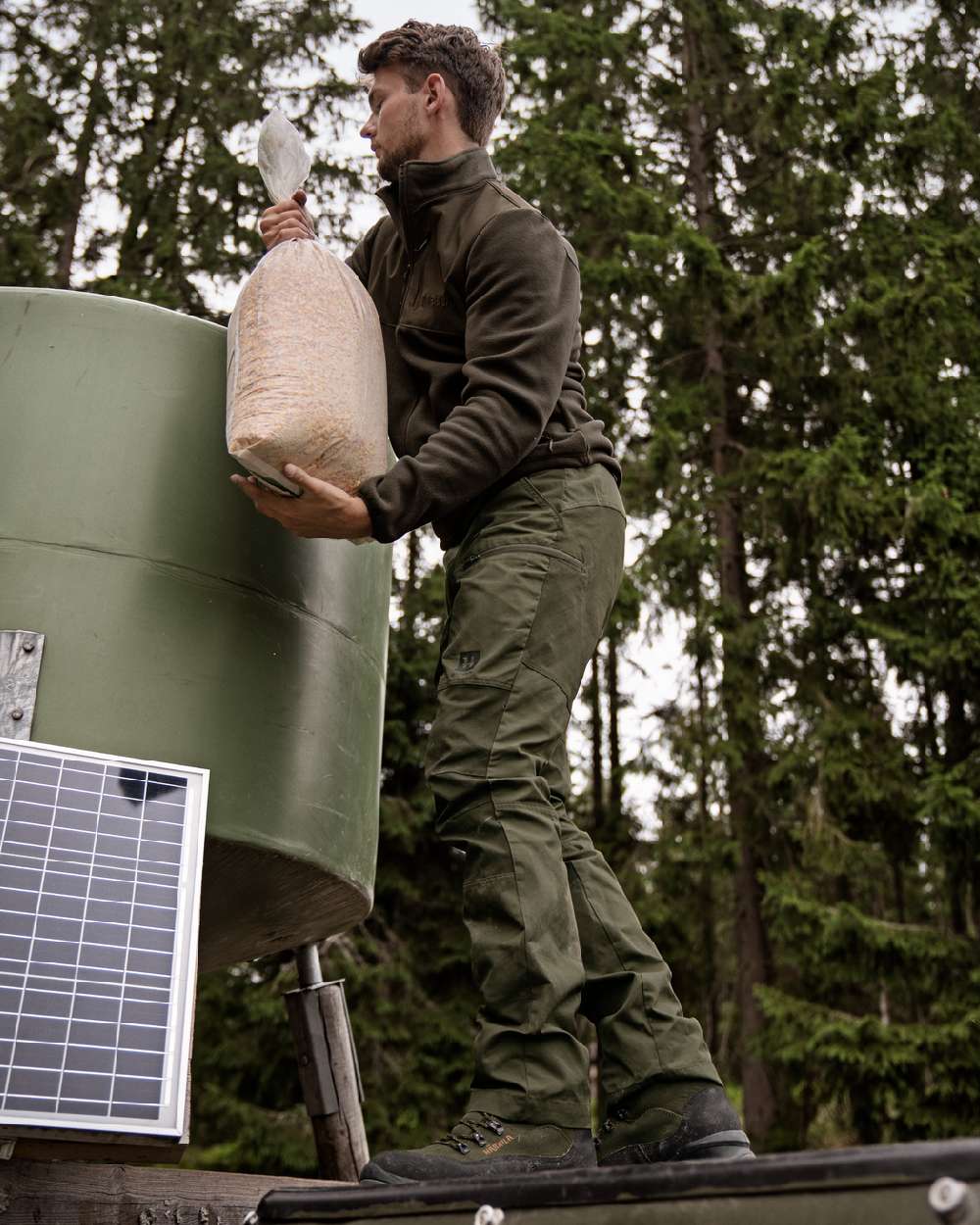 Shadow Brown Coloured Harkila Fjell Fleece Jacket on forest background 