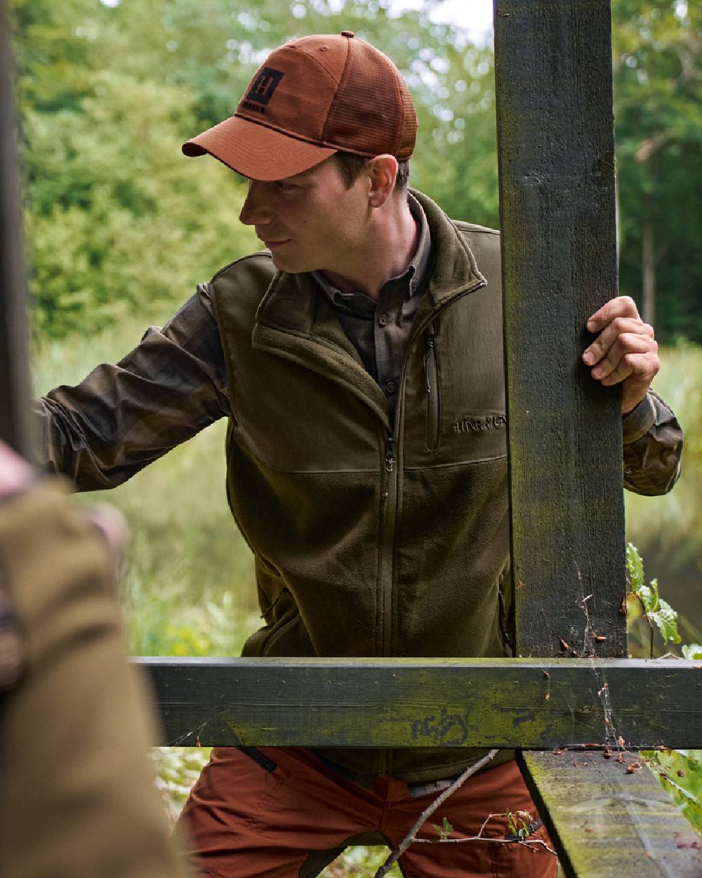 Hunting Green Willow Green Coloured Harkila Fjell Fleece Waistcoat on forest background 