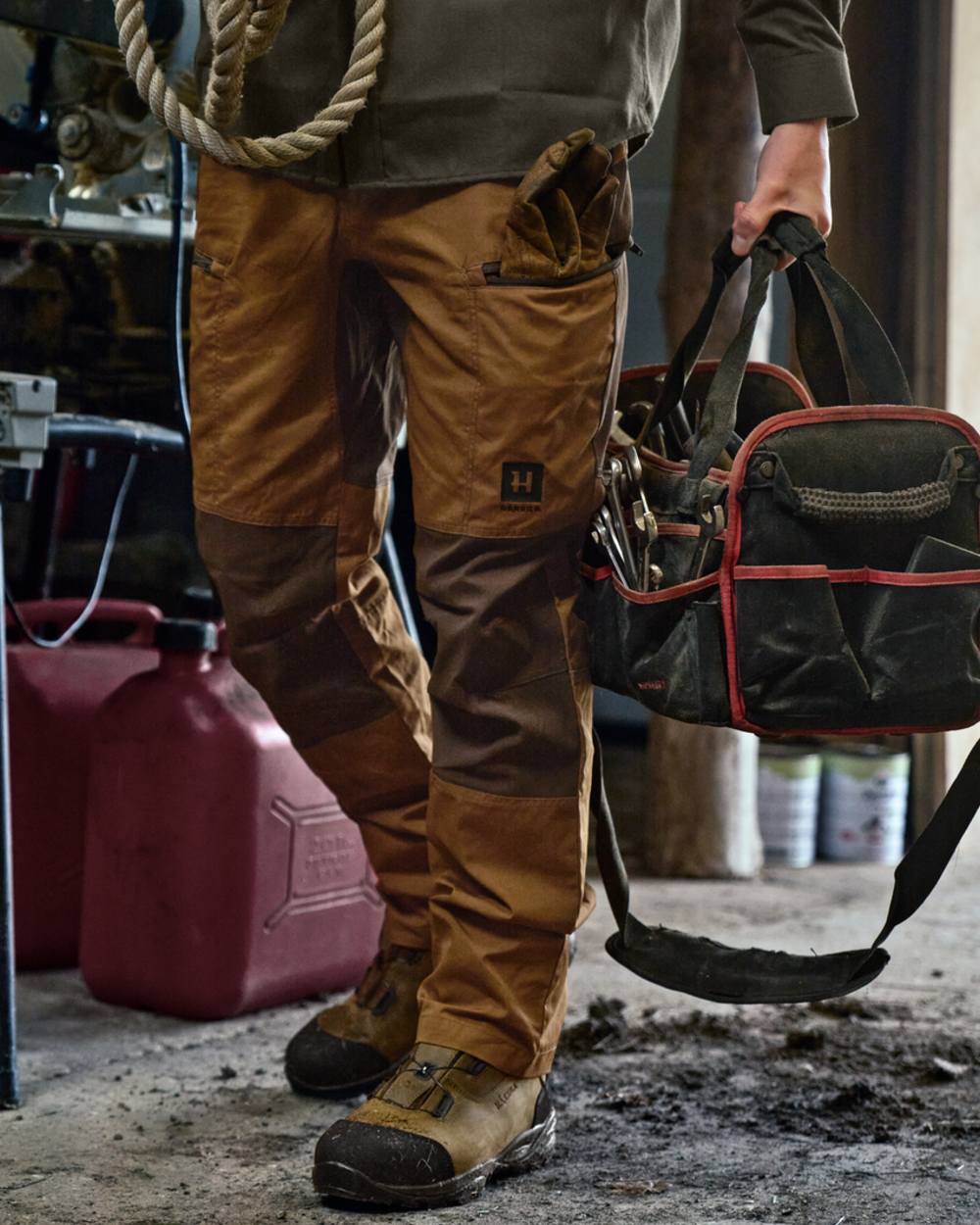 Rustique Clay Brown Coloured Harkila Fjell Trousers on factory background 