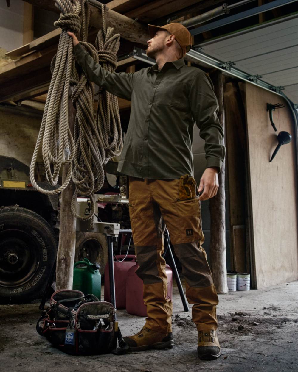 Rustique Clay Brown Coloured Harkila Fjell Trousers on factory background 