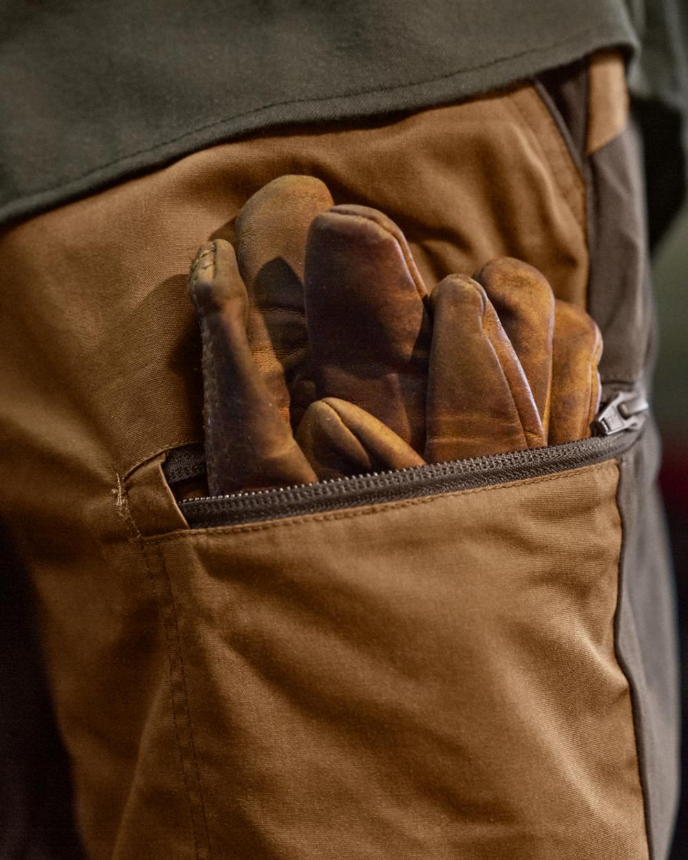Rustique Clay Brown Coloured Harkila Fjell Trousers on factory background 