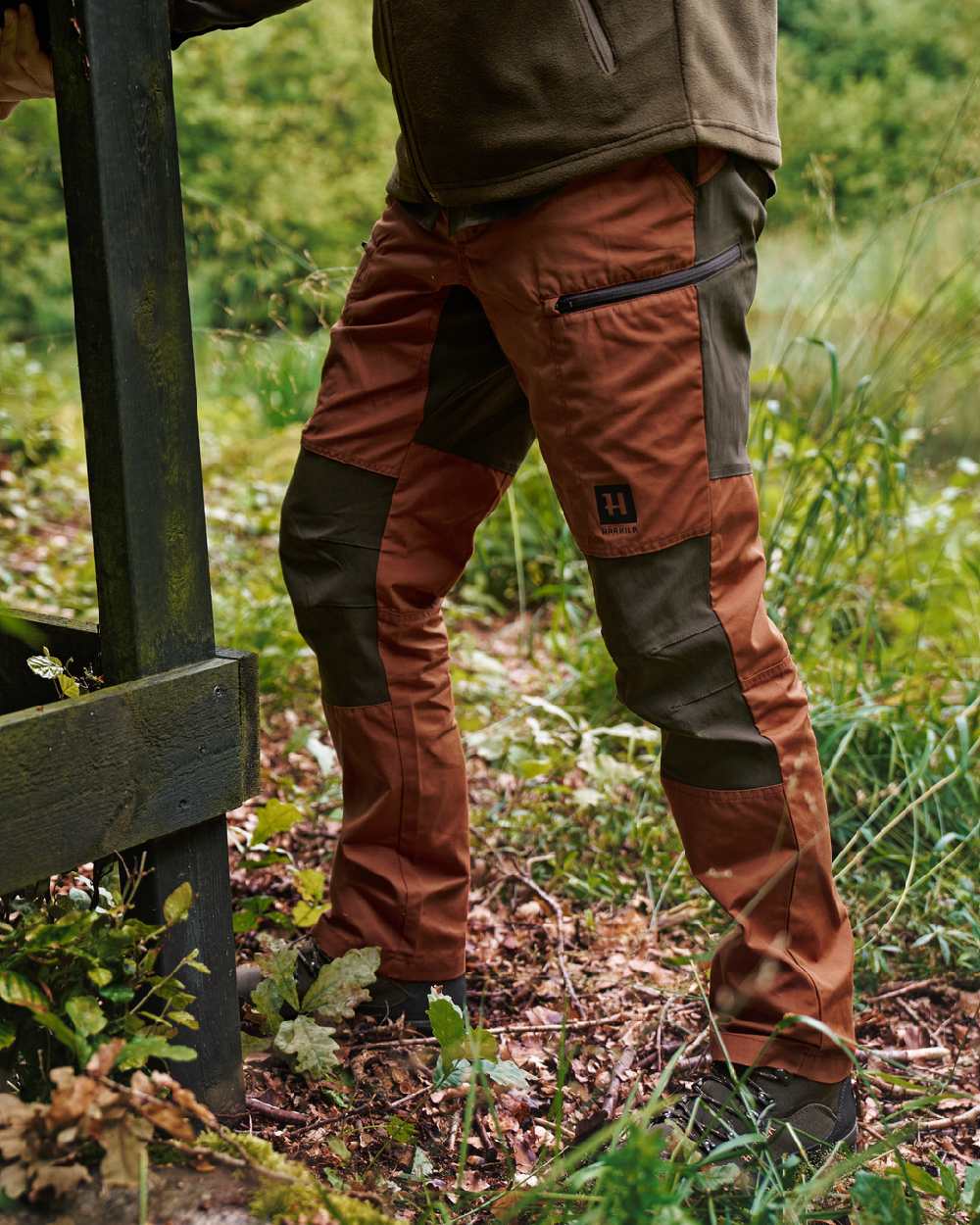 Shadow Brown Arabian Spice Coloured Harkila Fjell Trousers on forest background 