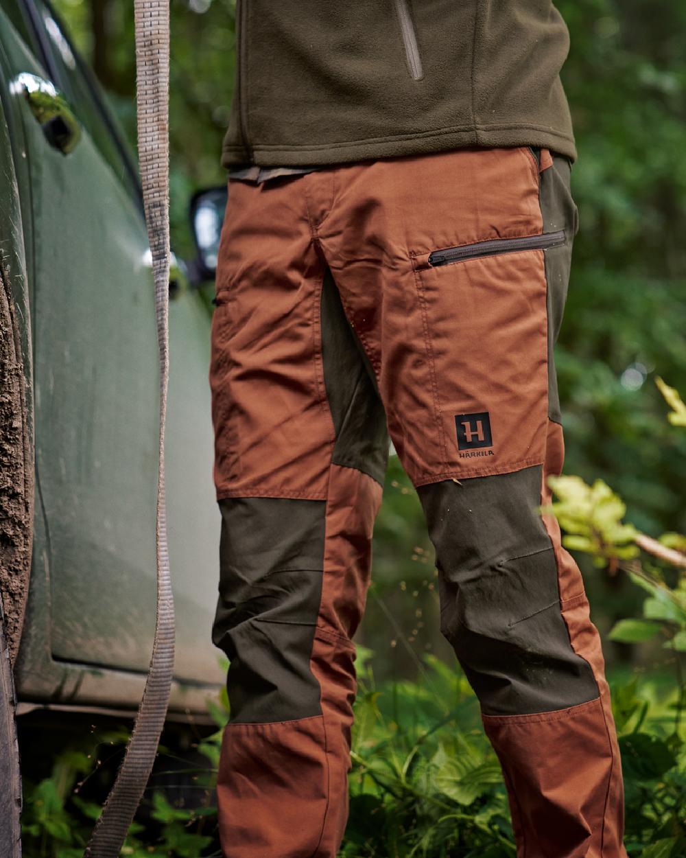 Shadow Brown Arabian Spice Coloured Harkila Fjell Trousers on forest background 