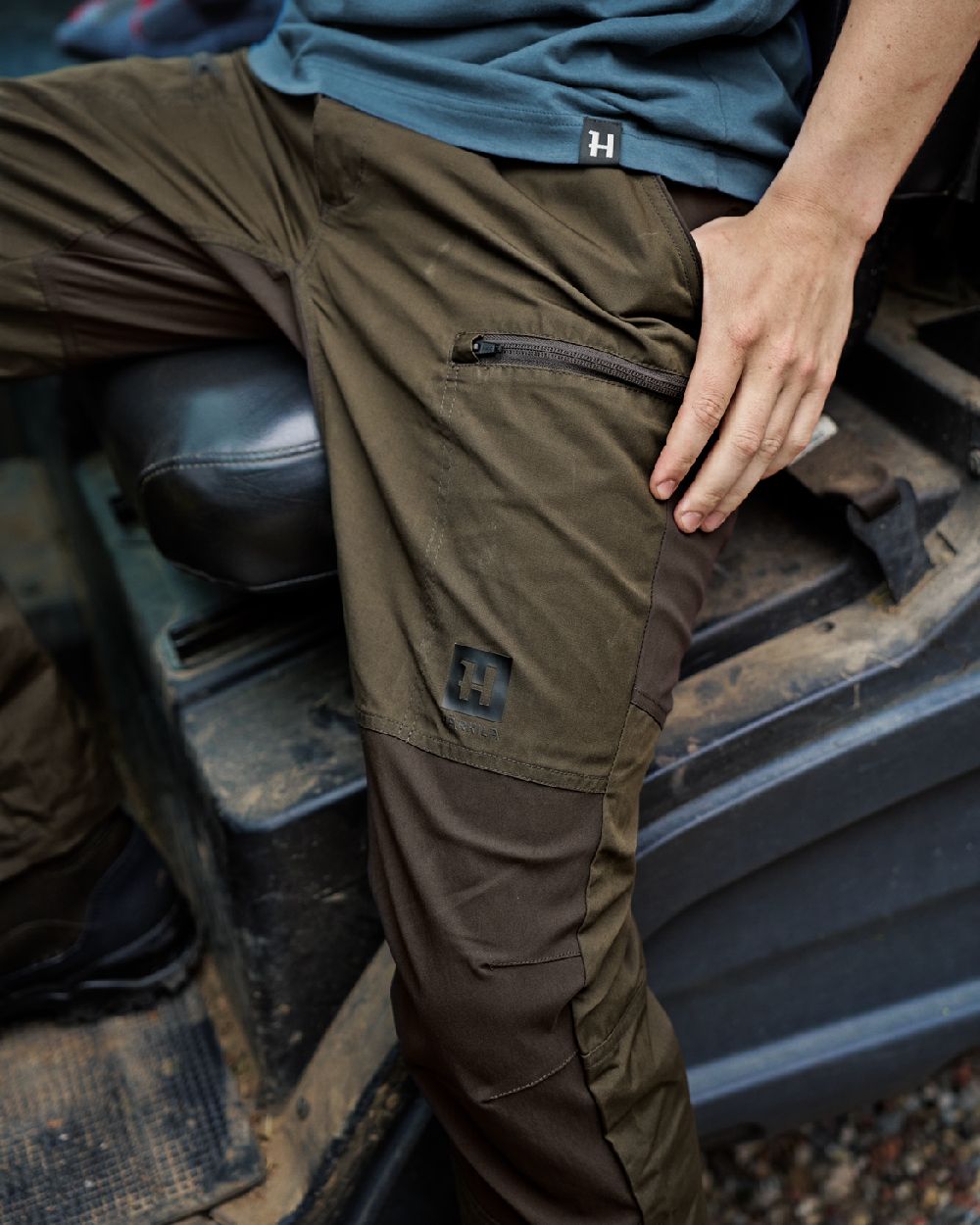 Willow Green Shadow Brown Coloured Harkila Fjell Trousers on outdoor background 
