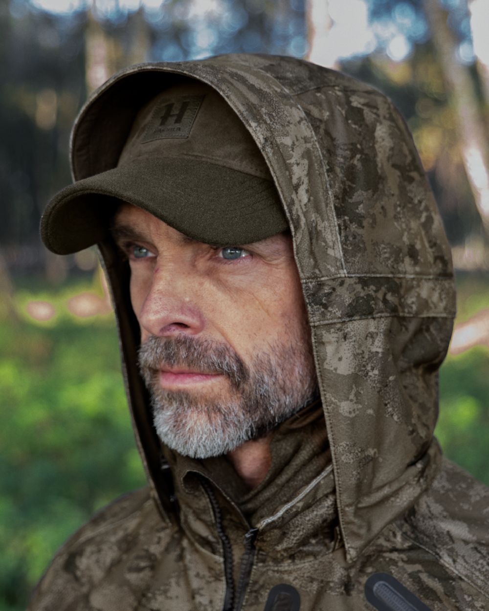 AXIS MSP Darkwood coloured Harkila Forest Hunter GTX Camo Jacket on forest background 
