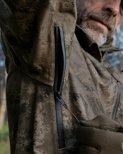 AXIS MSP Darkwood coloured Harkila Forest Hunter GTX Camo Jacket on forest background 